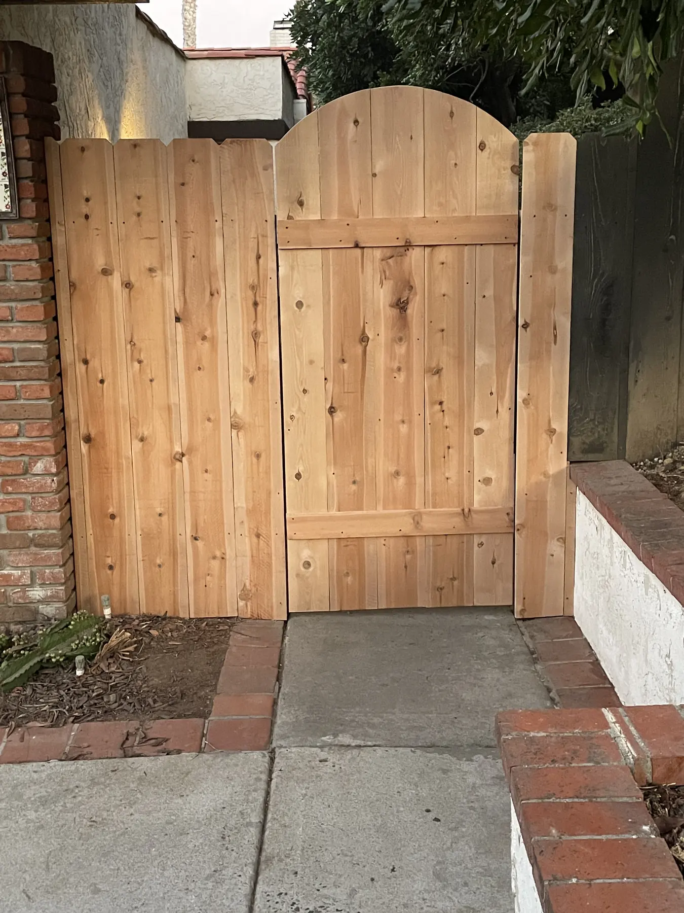 Cedar fence & arched gate in Carlsbad