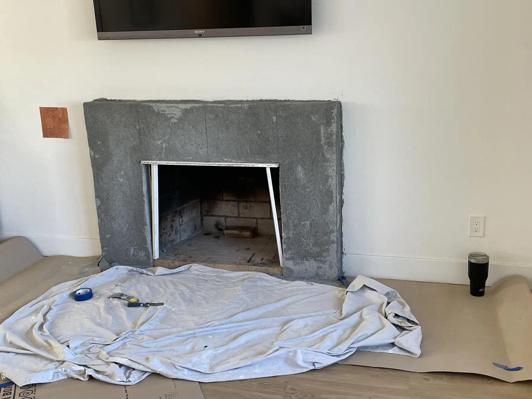 Grout-free clay tile fireplace, San Diego — before photo 3